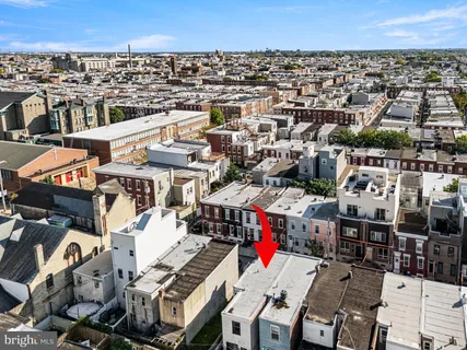 an aerial view of a building with outdoor space