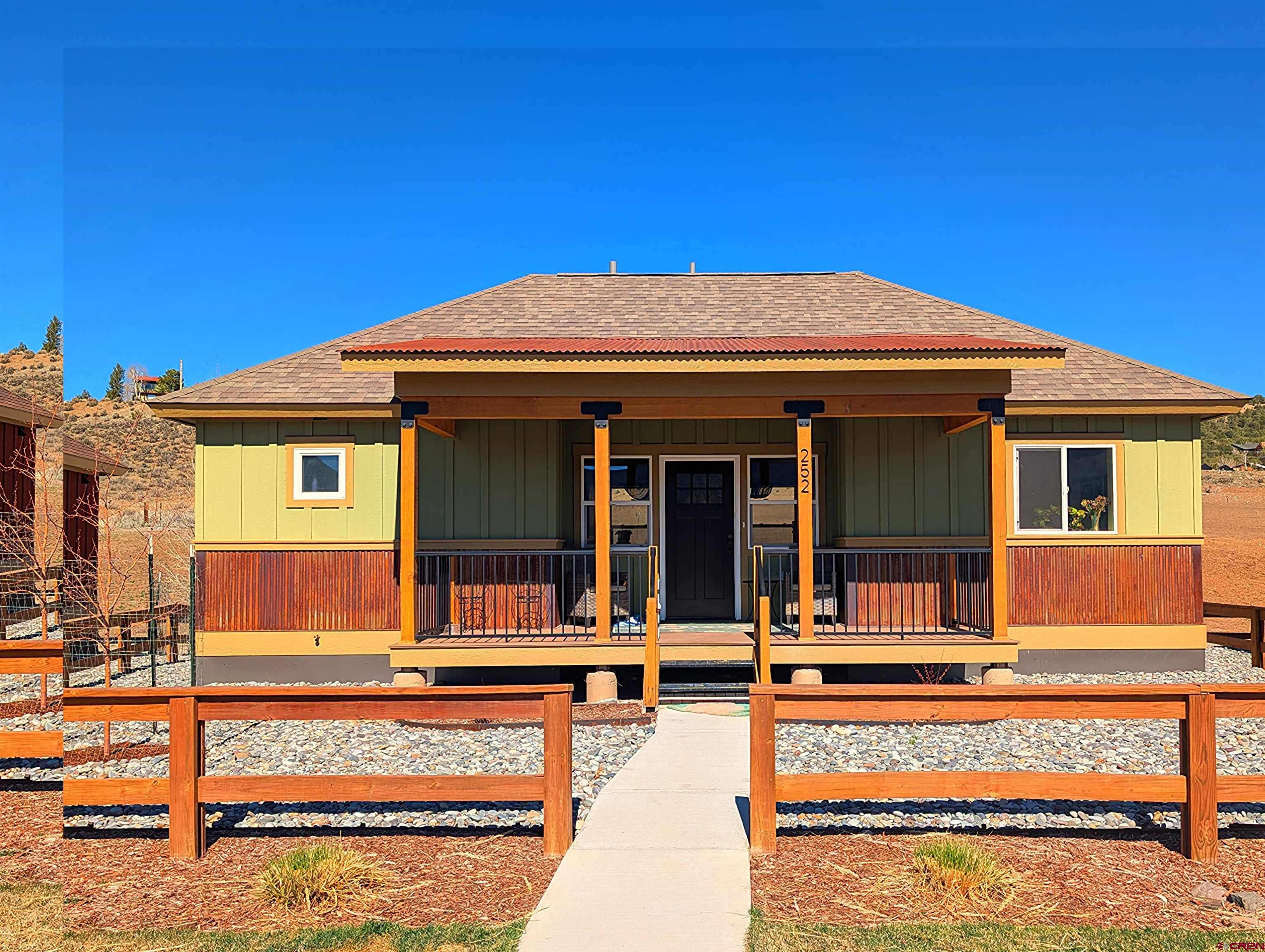 front view of a house with a swimming pool