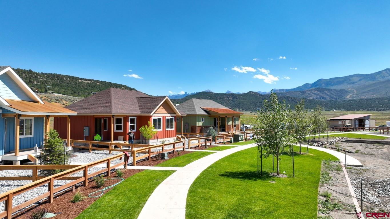 200 Redcliff Drive Ridgway, CO 81432 - Photo 2 of 3 a swimming pool view with a seating space and a garden view
