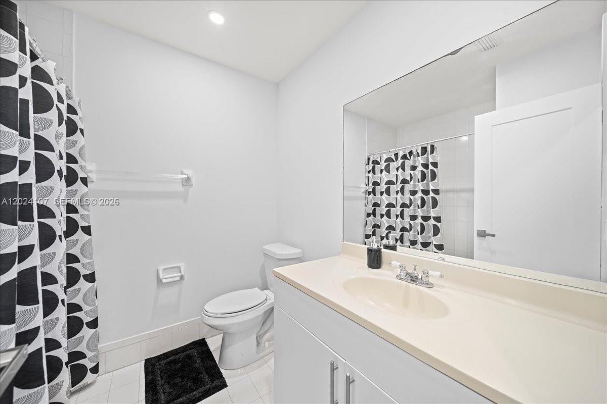 15341 Southwest 36th Street Miami, FL 33185 - Photo 19 of 56 a bathroom with a sink toilet and shower
