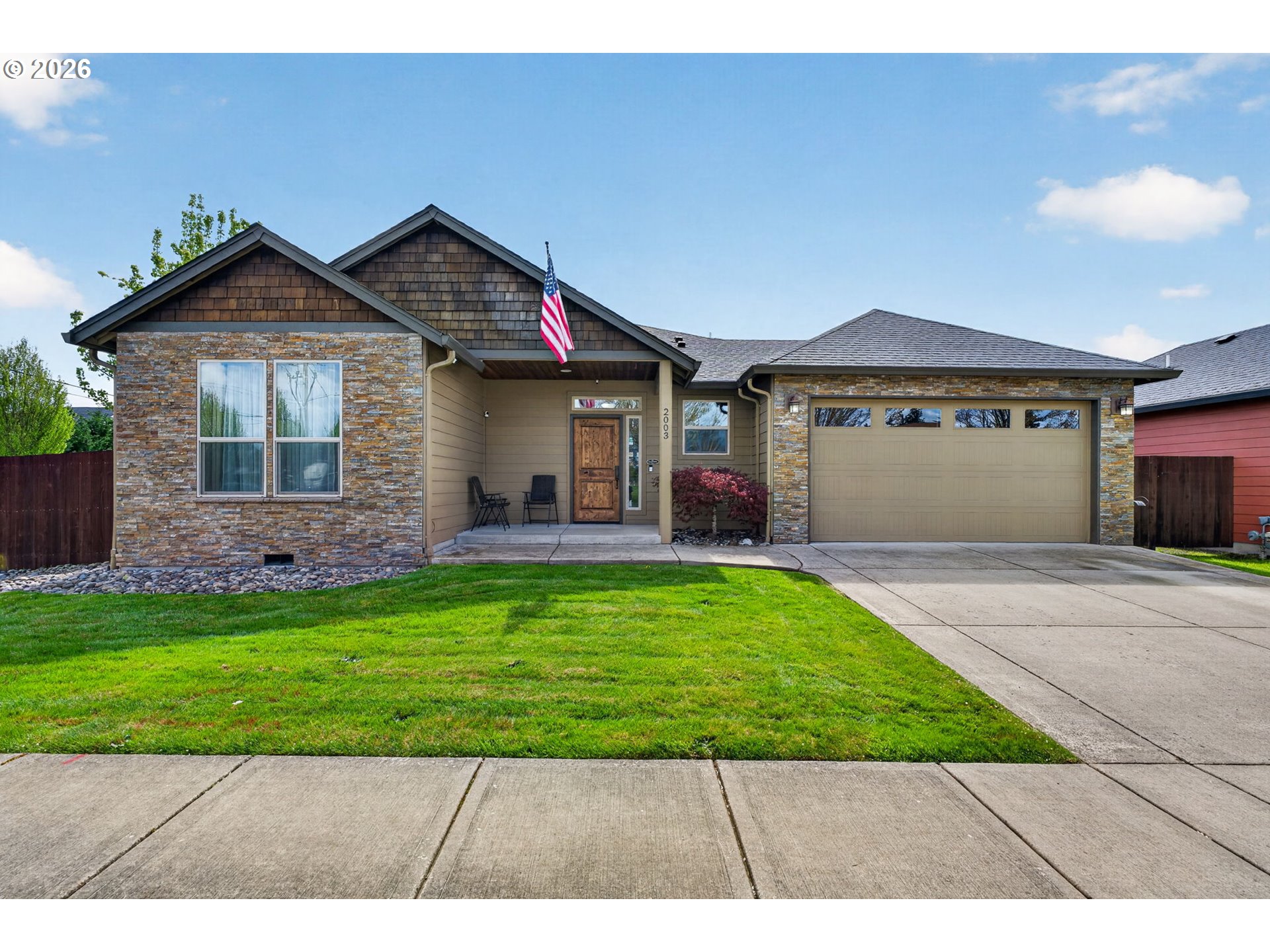 2003 Northwest 17th Street Battle Ground, WA 98604 - Photo 1 of 30 a front view of a house with a yard and garage