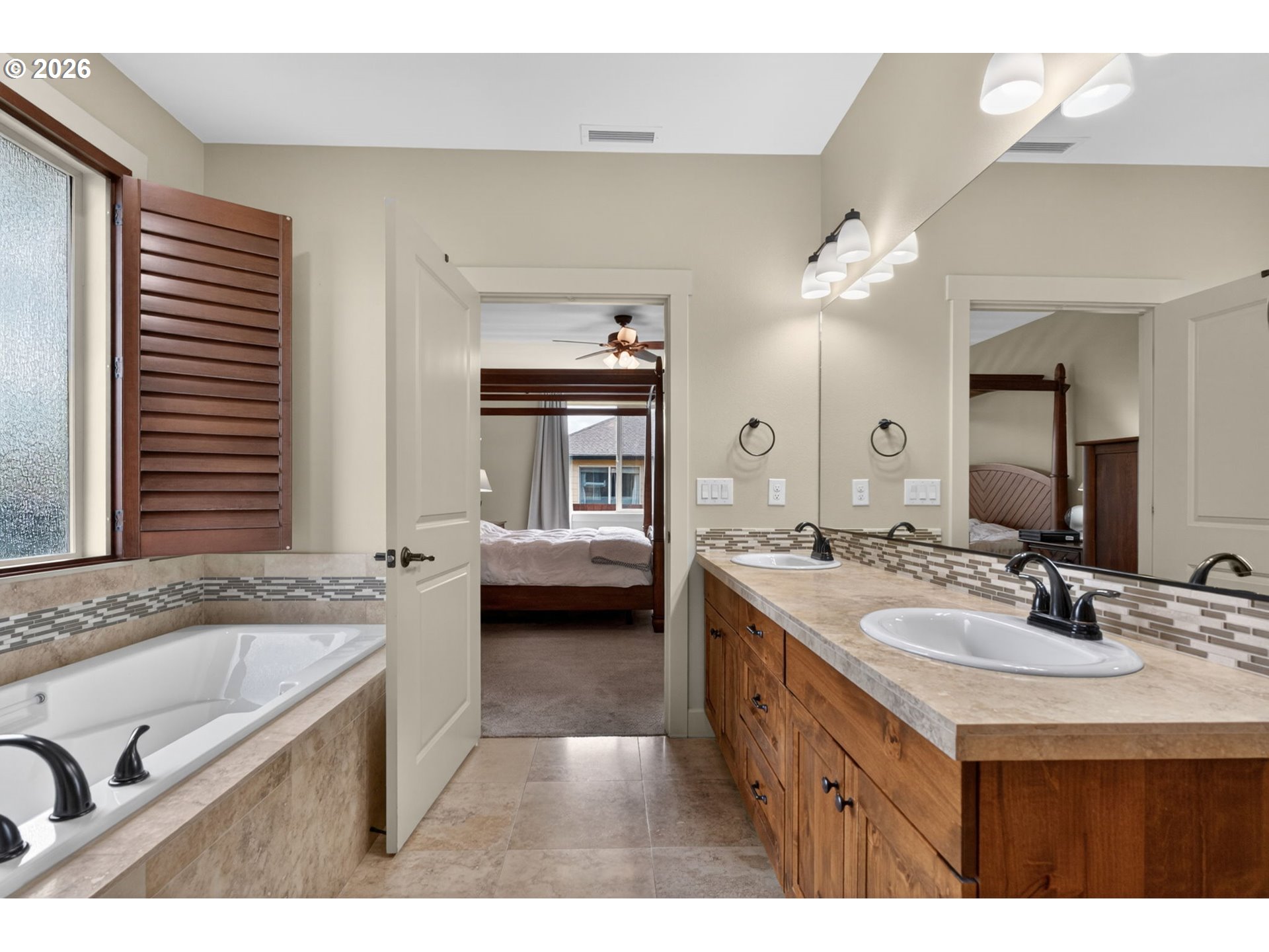 2003 Northwest 17th Street Battle Ground, WA 98604 - Photo 16 of 30 a spacious bathroom with a tub double sink and mirror