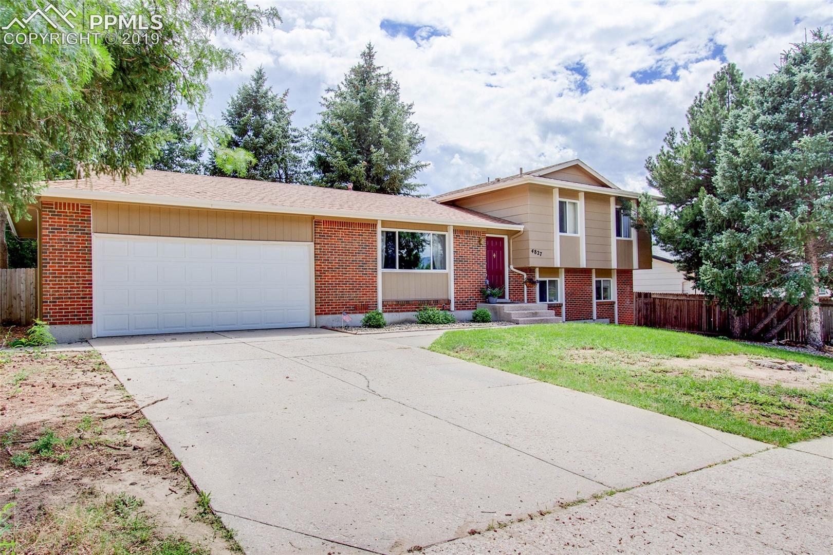 4827 Del Sol Road Colorado Springs, CO 80918 - Photo 1 of 24 Front of the property to include the 2-car attached garage.