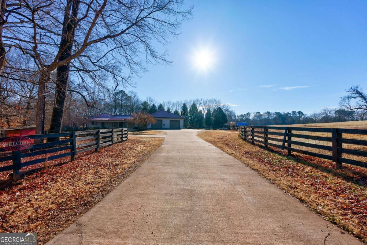 2223 Salem Road Watkinsville, GA 30677 - Photo 11 of 63 a view of a yard with wooden fence