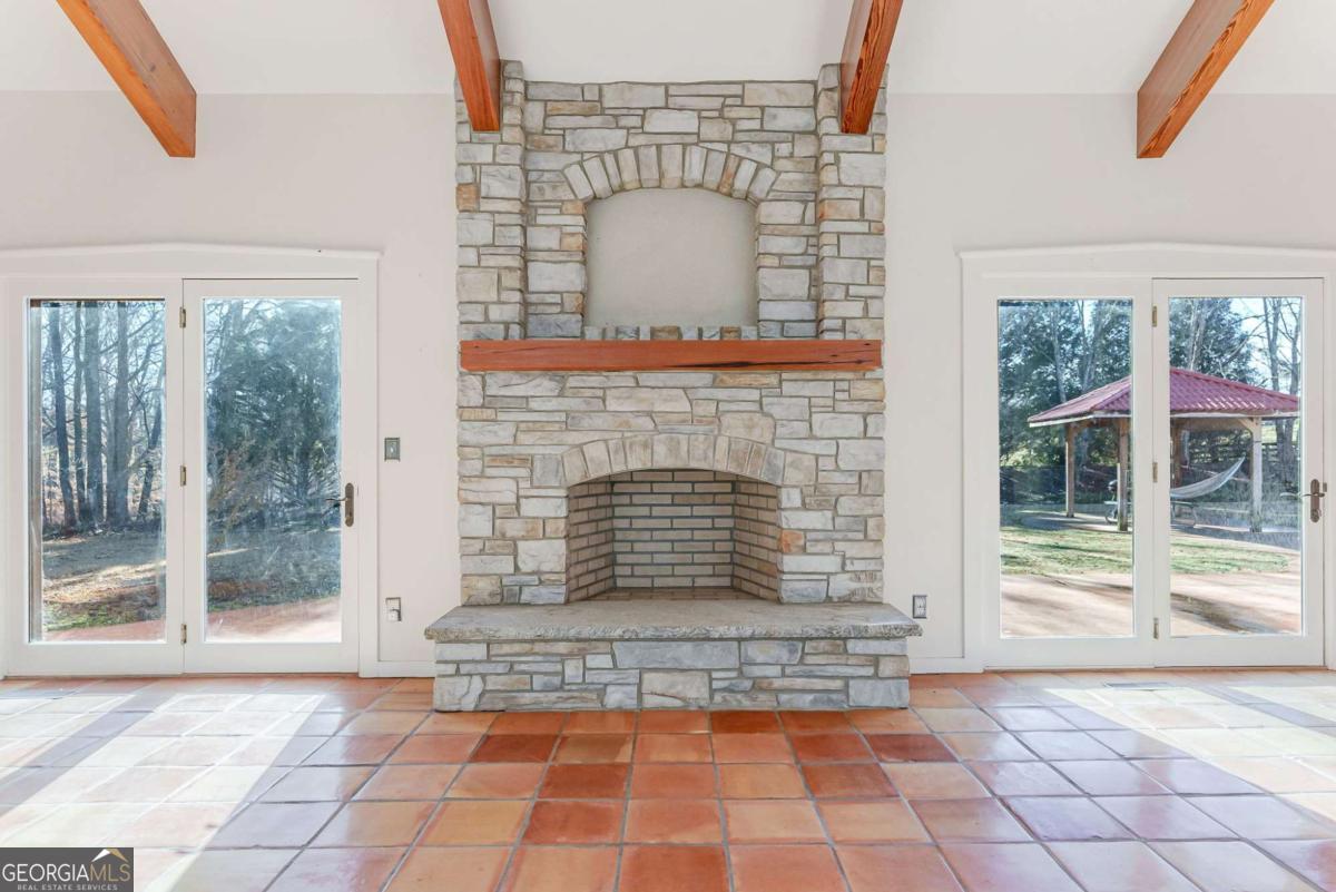 2223 Salem Road Watkinsville, GA 30677 - Photo 20 of 63 a view of a livingroom with wooden floor and a fireplace