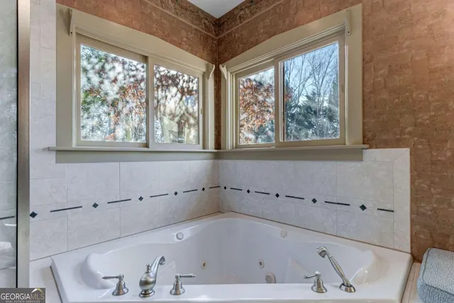 a kitchen with stainless steel appliances granite countertop a refrigerator and microwave