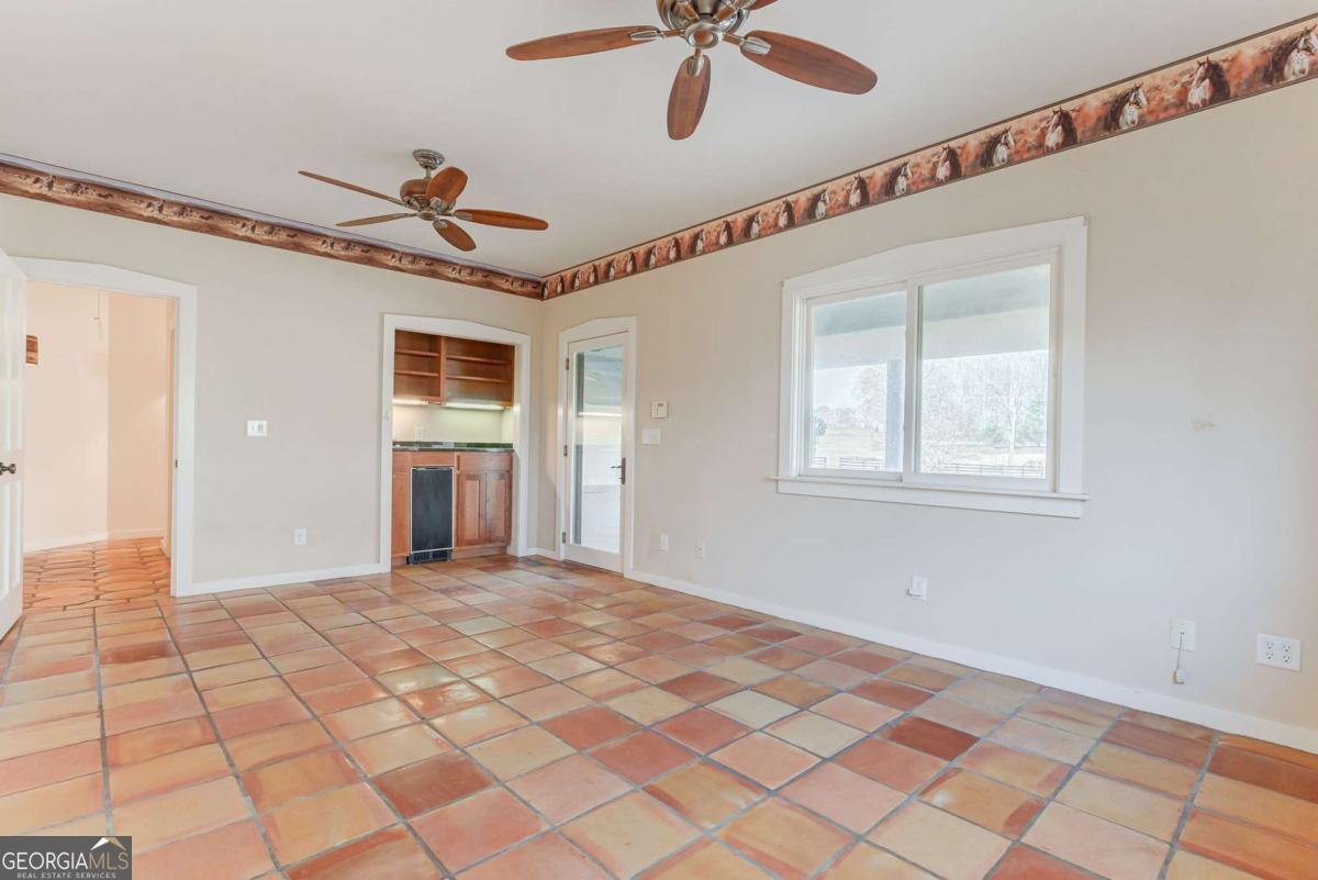 2223 Salem Road Watkinsville, GA 30677 - Photo 28 of 63 a view of a livingroom with a ceiling fan and window