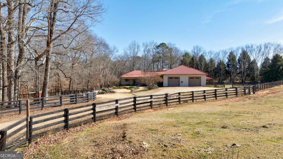 2223 Salem Road Watkinsville, GA 30677 - Photo 3 of 63 a view of a terrace with trees