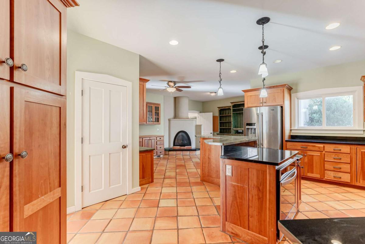 2223 Salem Road Watkinsville, GA 30677 - Photo 31 of 63 a kitchen with stainless steel appliances granite countertop a refrigerator and microwave