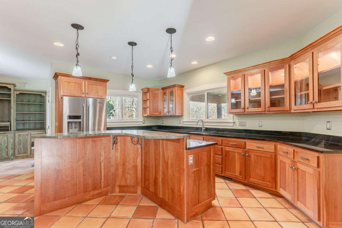2223 Salem Road Watkinsville, GA 30677 - Photo 32 of 63 a kitchen with stainless steel appliances granite countertop a stove a sink and a refrigerator