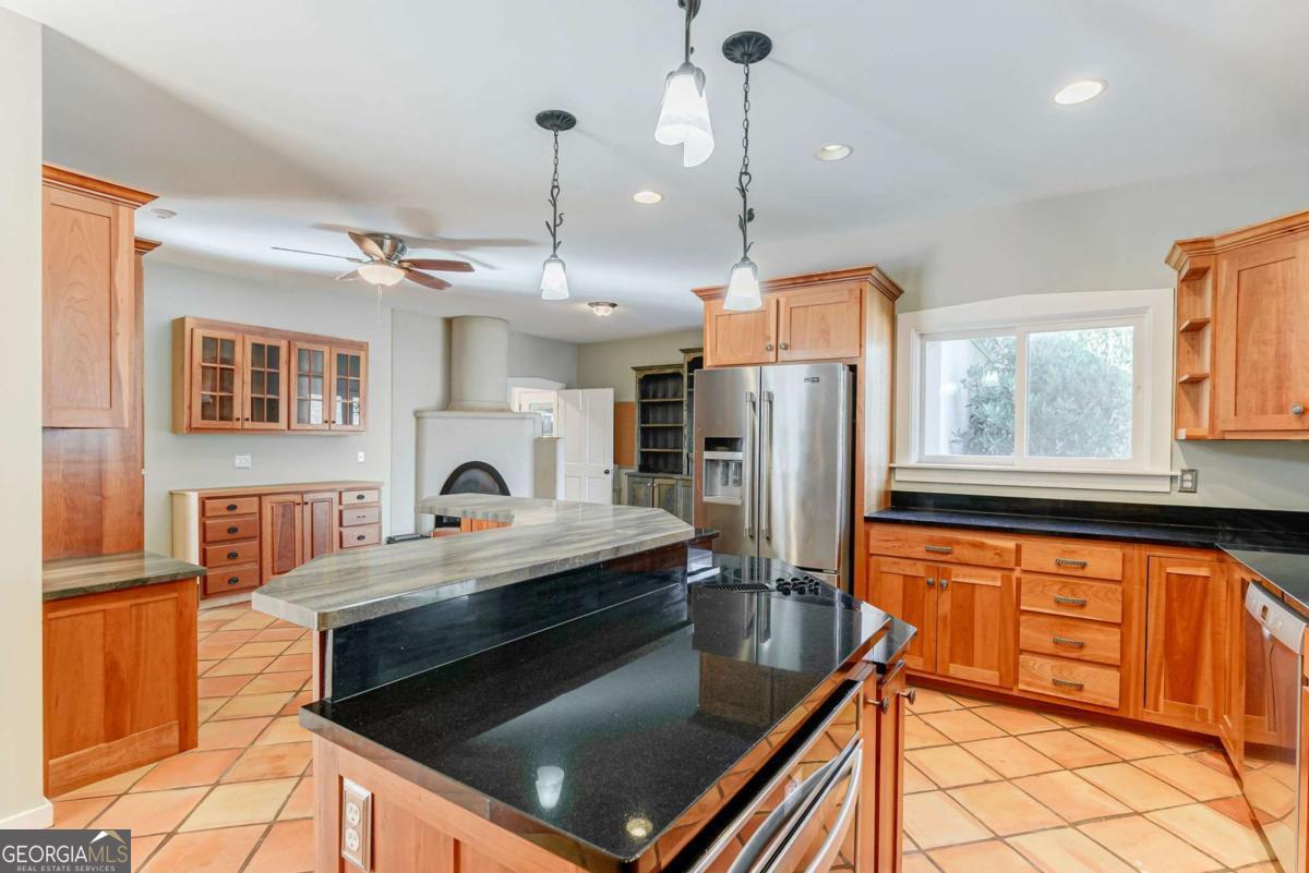 2223 Salem Road Watkinsville, GA 30677 - Photo 35 of 63 a kitchen with stainless steel appliances granite countertop a refrigerator a stove and a sink with granite countertops
