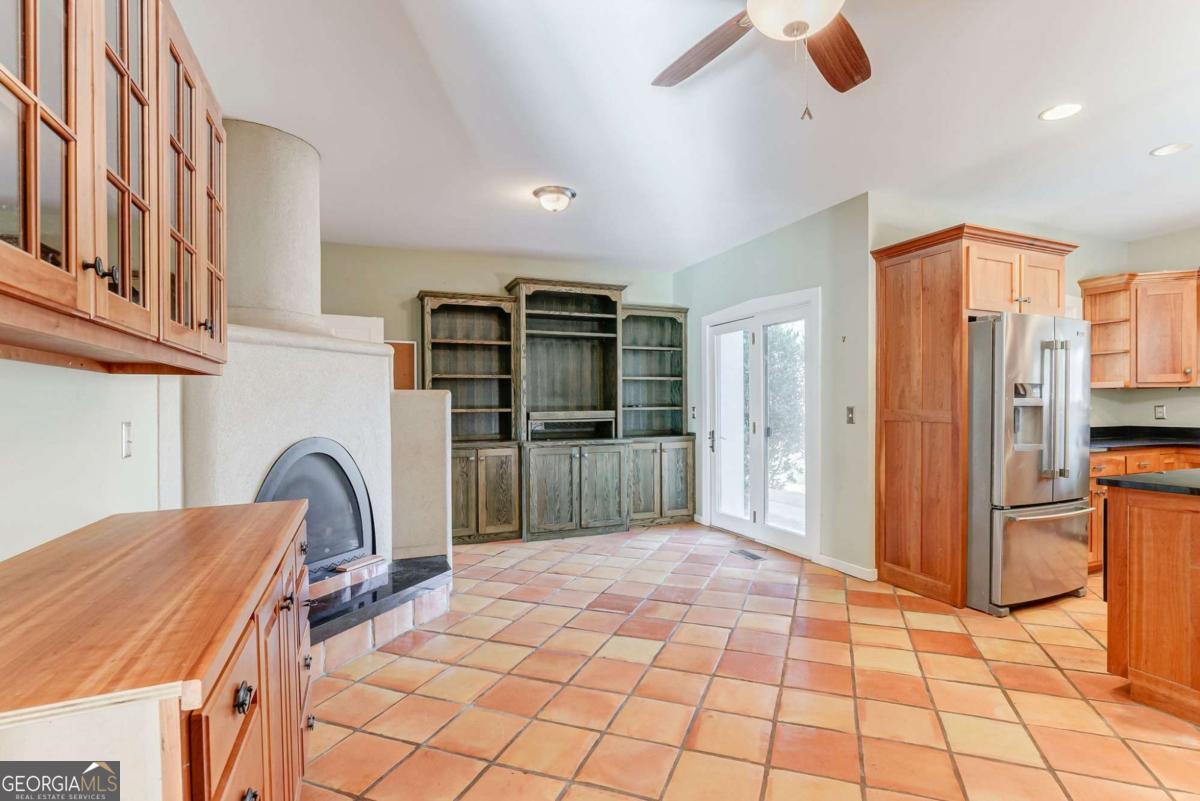 2223 Salem Road Watkinsville, GA 30677 - Photo 36 of 63 a kitchen with stainless steel appliances granite countertop a refrigerator and a stove top oven
