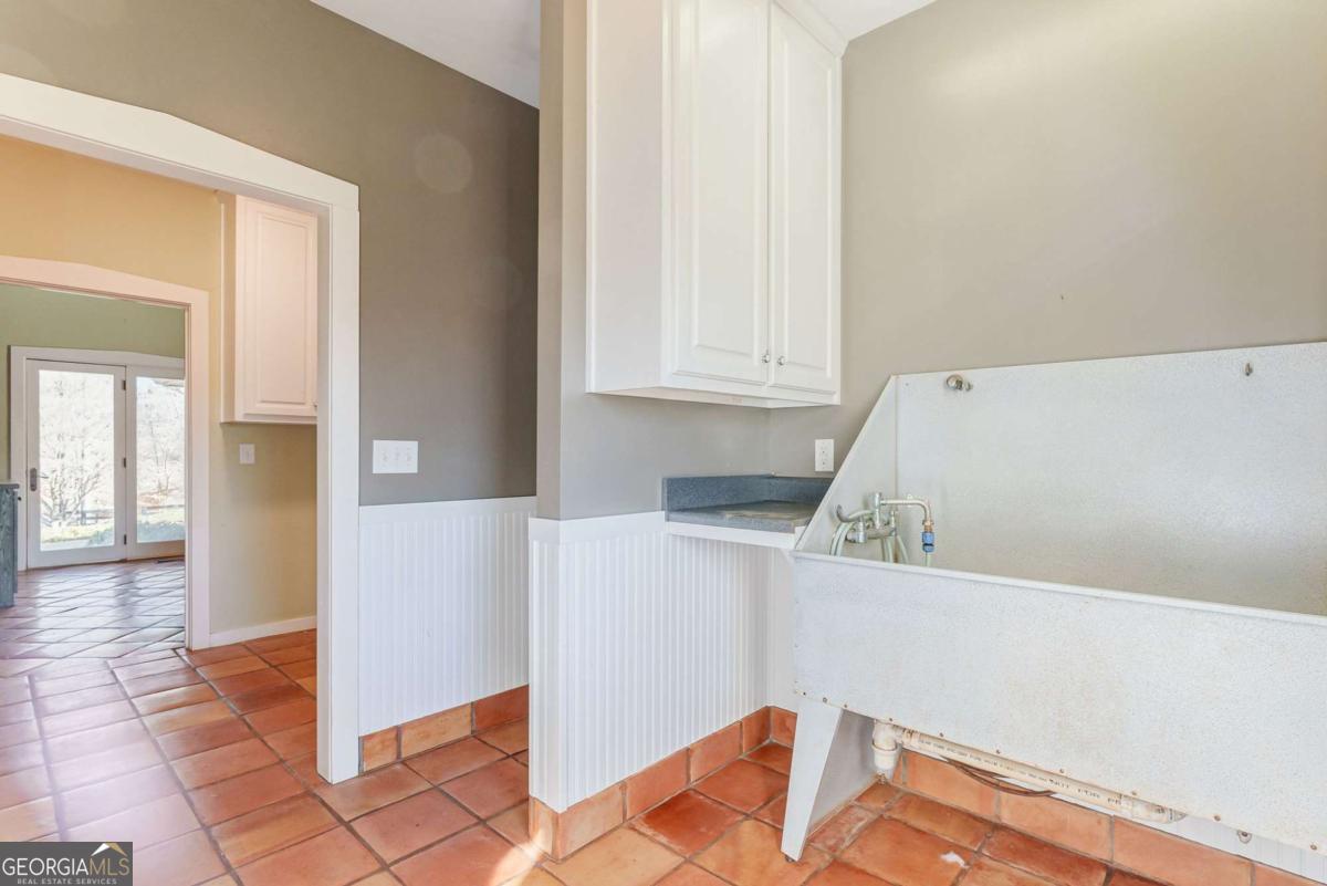 2223 Salem Road Watkinsville, GA 30677 - Photo 39 of 63 a view of a kitchen with furniture and wooden floor