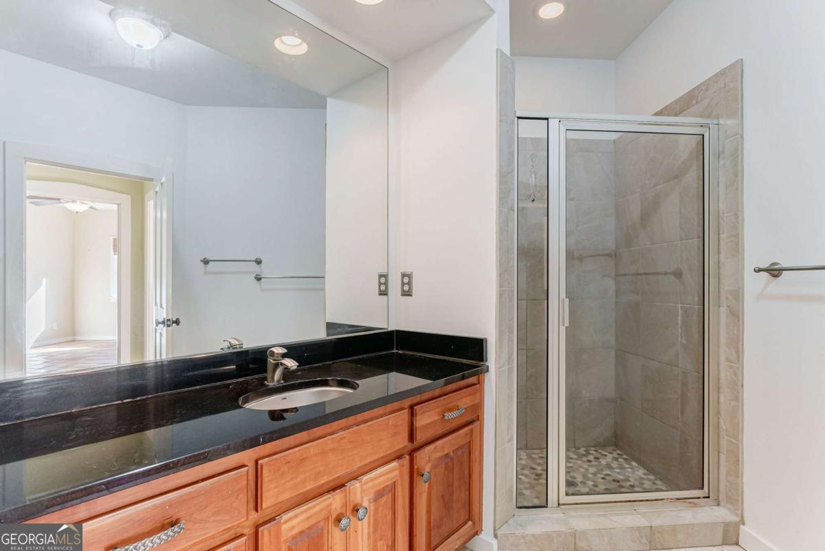 2223 Salem Road Watkinsville, GA 30677 - Photo 40 of 63 a bathroom with a sink and a mirror