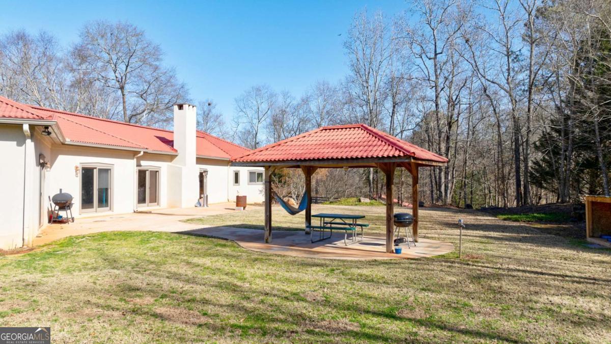 2223 Salem Road Watkinsville, GA 30677 - Photo 43 of 63 a front view of a house with garden