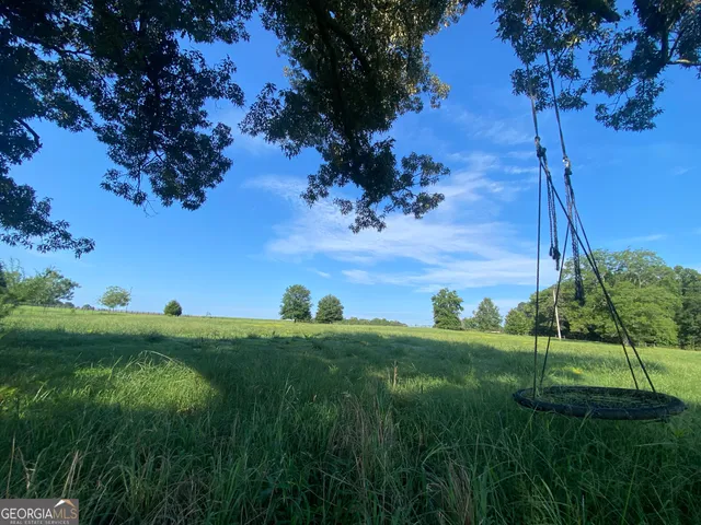 a view of an entryway with wooden stairs