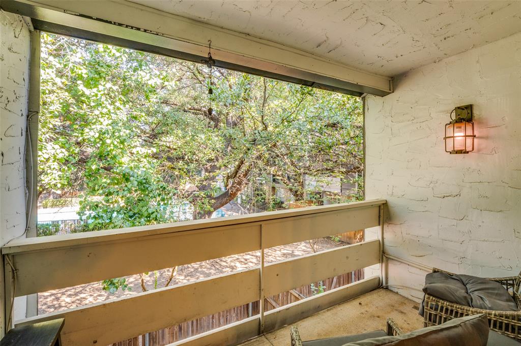 5840 Spring Valley Road, Unit 802 Dallas, TX 75254 - Photo 24 of 26 a view of a floor to ceiling window and an outdoor view