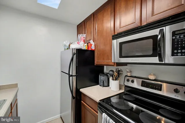 a kitchen with a stove and a microwave