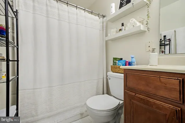 a bathroom with a toilet and a sink