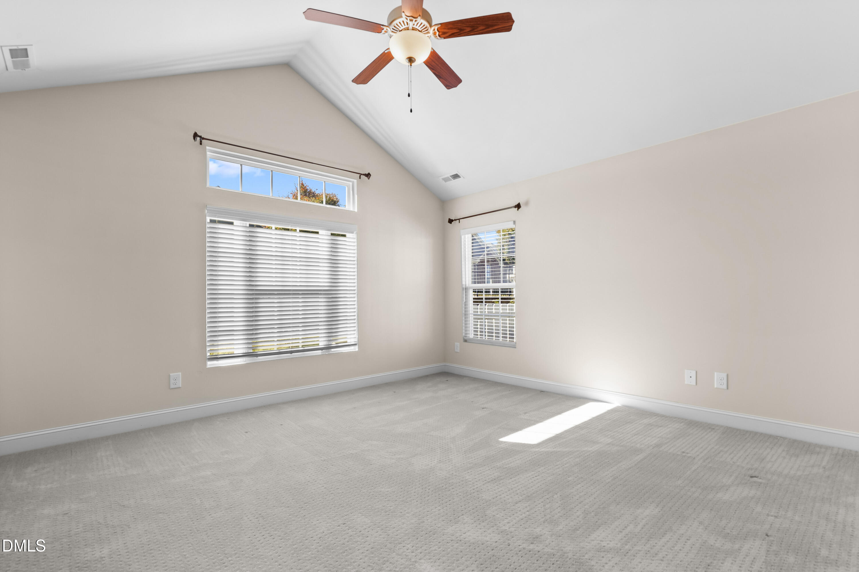 1663 Winter Wren Circle Wake Forest, NC 27587 - Photo 18 of 31 an empty room with windows and fan