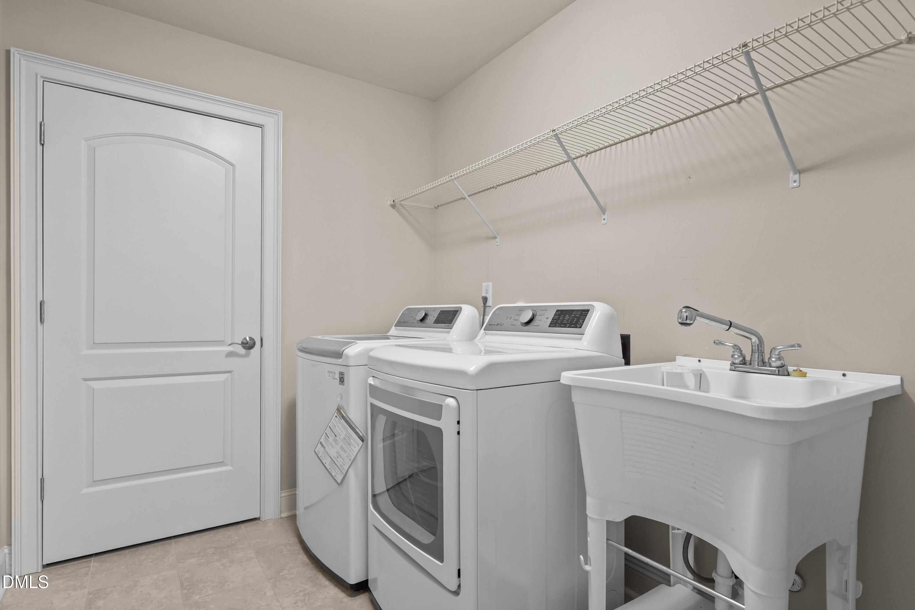 1663 Winter Wren Circle Wake Forest, NC 27587 - Photo 24 of 31 a utility room with dryer and washer
