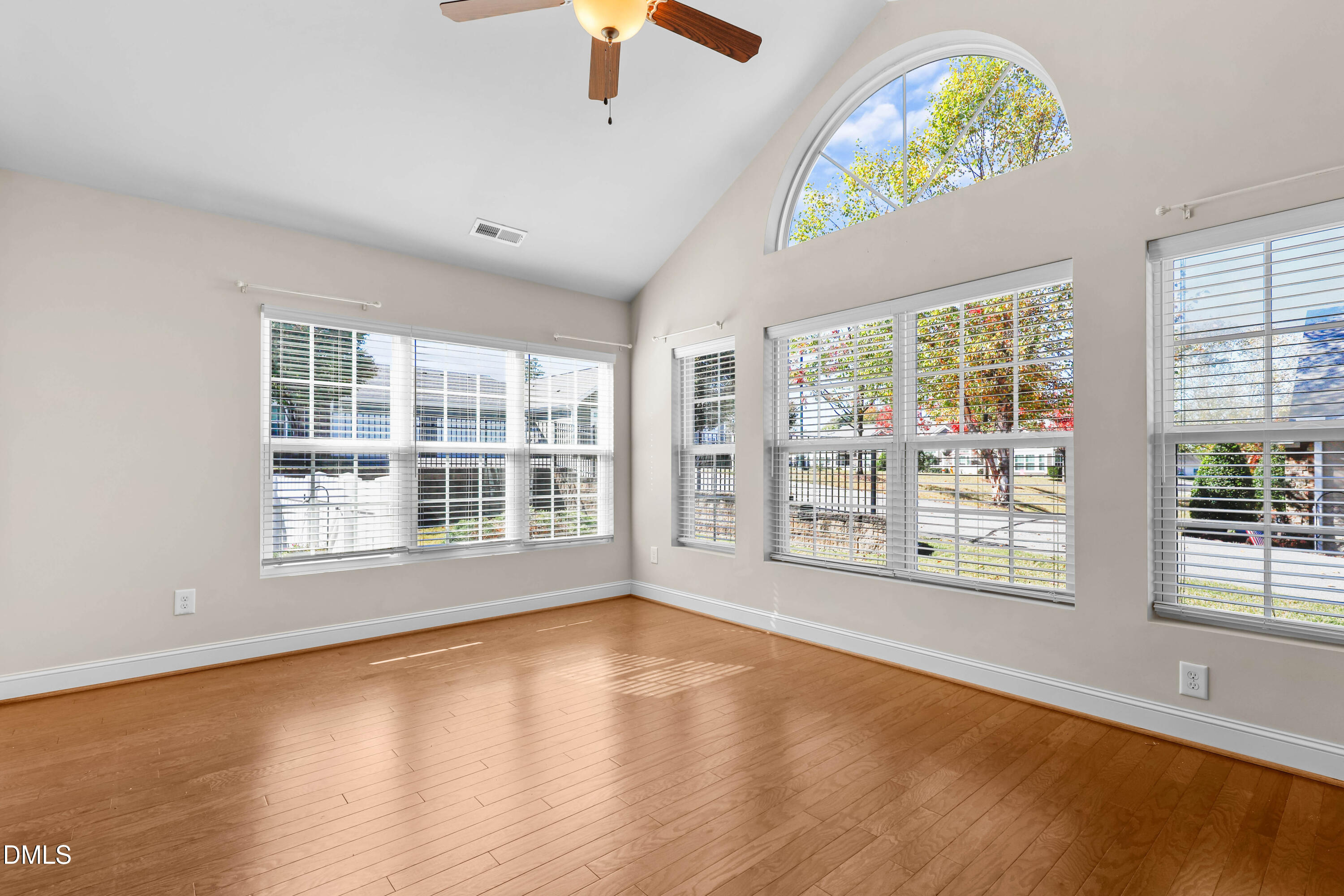 1663 Winter Wren Circle Wake Forest, NC 27587 - Photo 6 of 31 a view of an empty room with a window and wooden floor