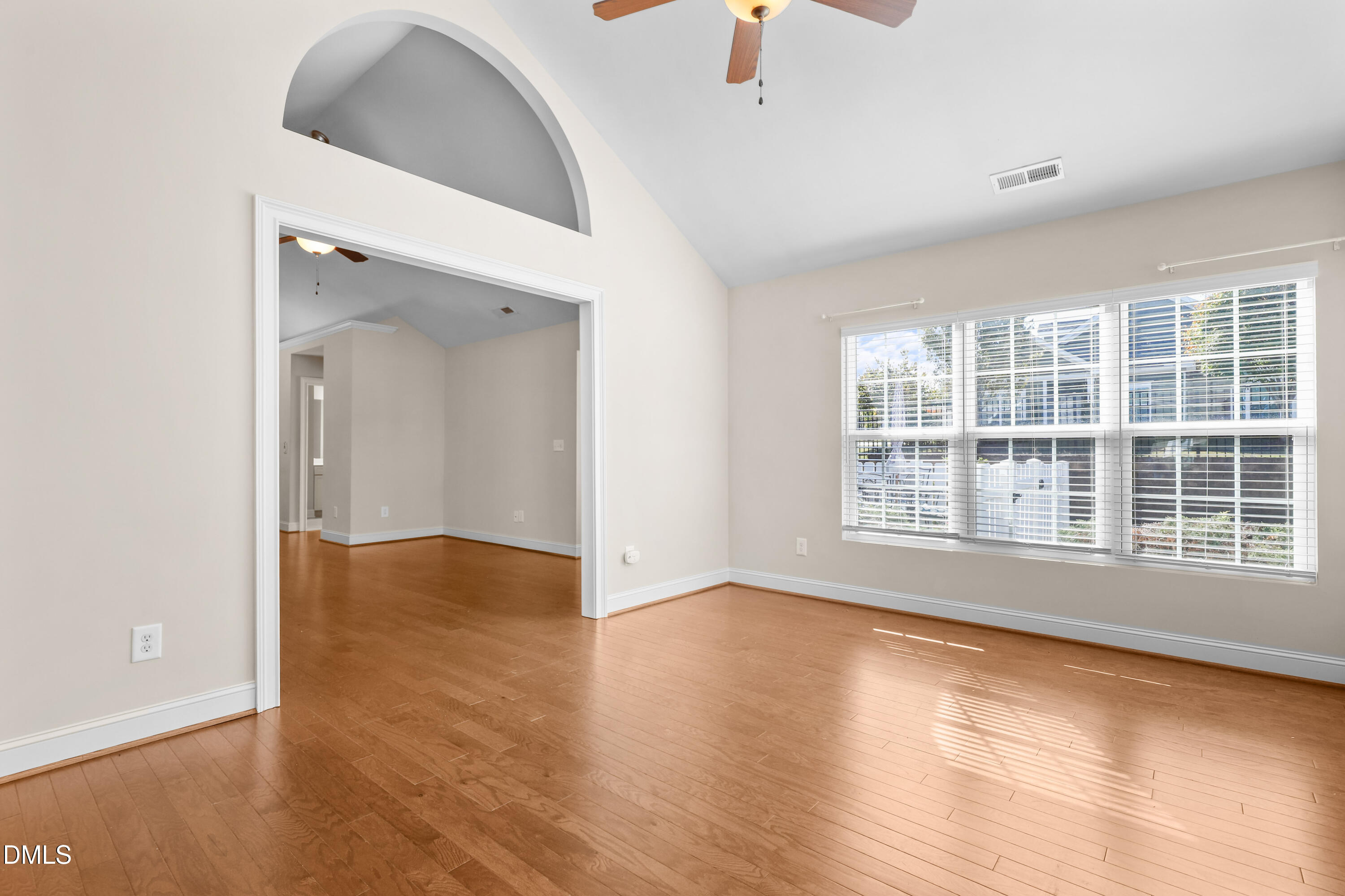 1663 Winter Wren Circle Wake Forest, NC 27587 - Photo 7 of 31 an empty room with wooden floor and windows