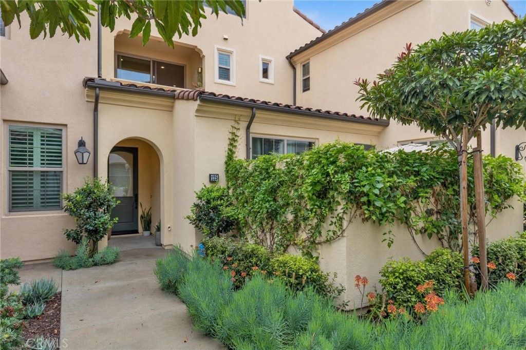 125 Leafy Twig Irvine, CA 92618 - Photo 1 of 35 a house view with a garden space