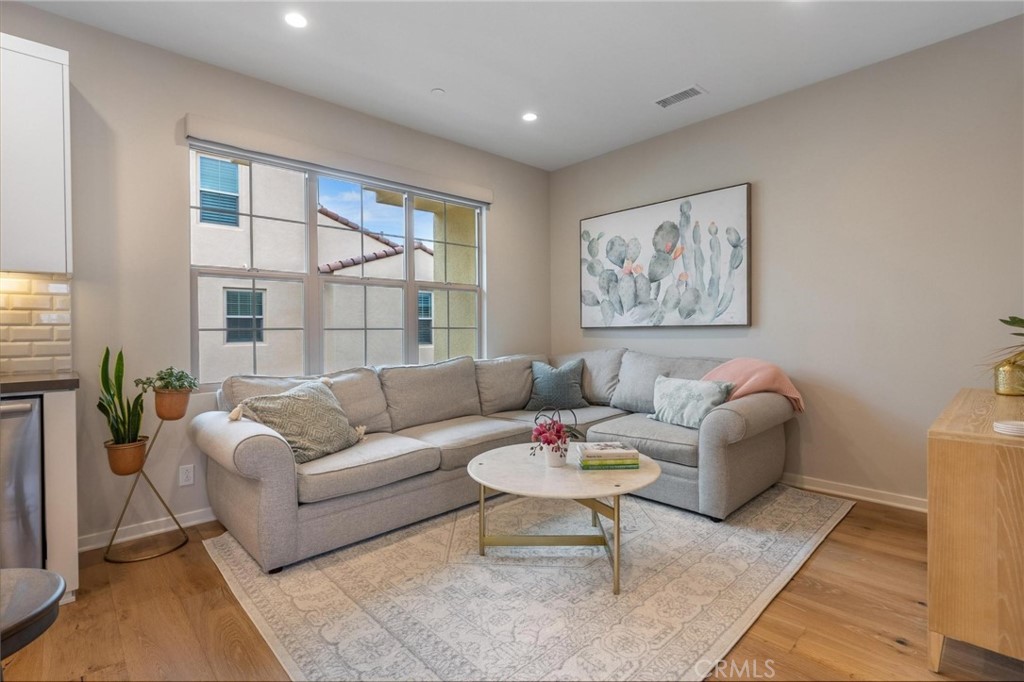 125 Leafy Twig Irvine, CA 92618 - Photo 14 of 35 a living room with furniture and a large window