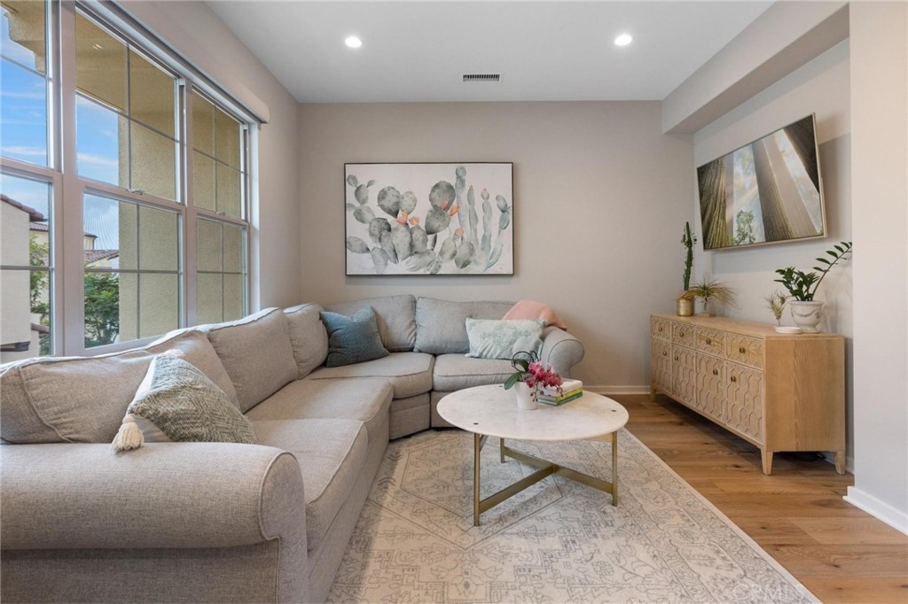 125 Leafy Twig Irvine, CA 92618 - Photo 15 of 35 a living room with furniture and a large window
