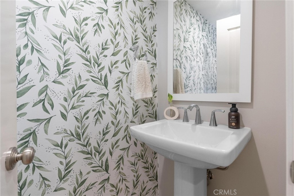 125 Leafy Twig Irvine, CA 92618 - Photo 16 of 35 a bathroom with a sink and a mirror