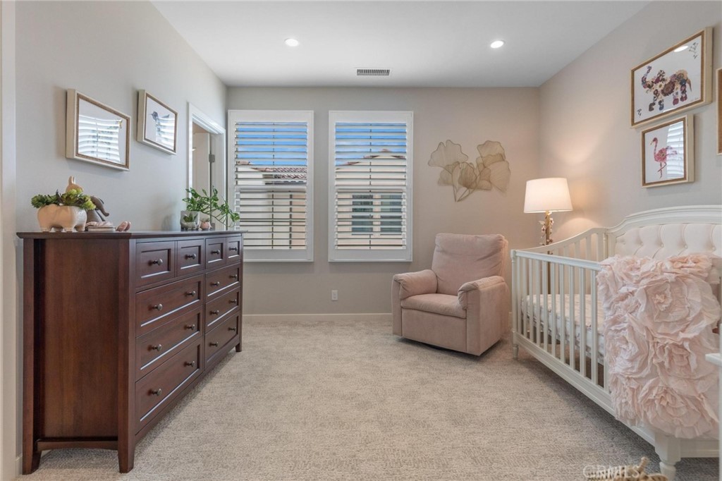 125 Leafy Twig Irvine, CA 92618 - Photo 23 of 35 a bedroom with furniture and a window