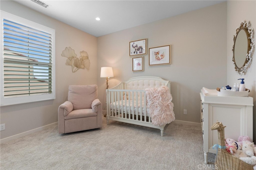 125 Leafy Twig Irvine, CA 92618 - Photo 24 of 35 a bedroom with a bed and a couch