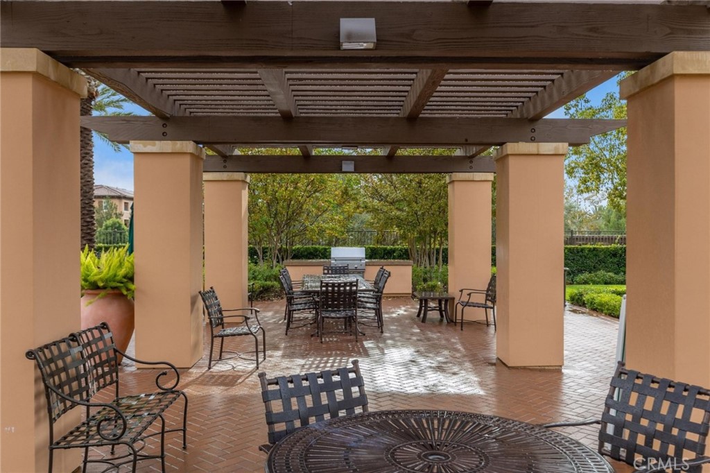 125 Leafy Twig Irvine, CA 92618 - Photo 32 of 35 a patio with yard glass top table and chairs