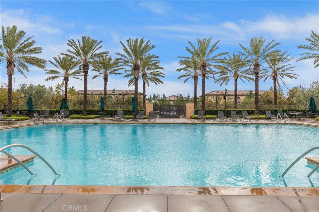 125 Leafy Twig Irvine, CA 92618 - Photo 35 of 35 a view of a lake with a palm tree