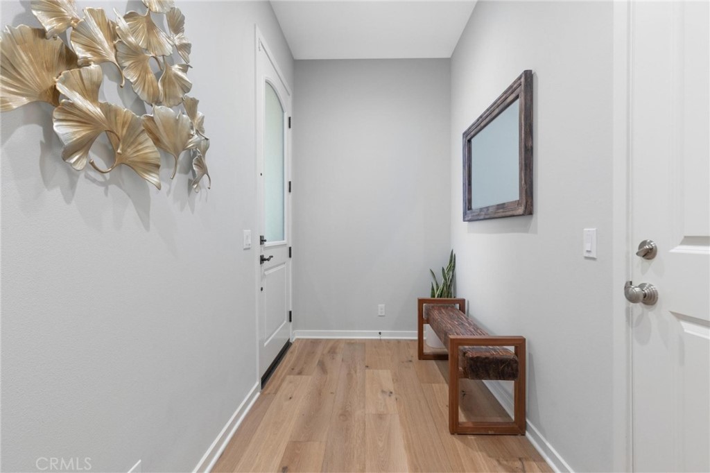 125 Leafy Twig Irvine, CA 92618 - Photo 5 of 35 a hallway with table and chair