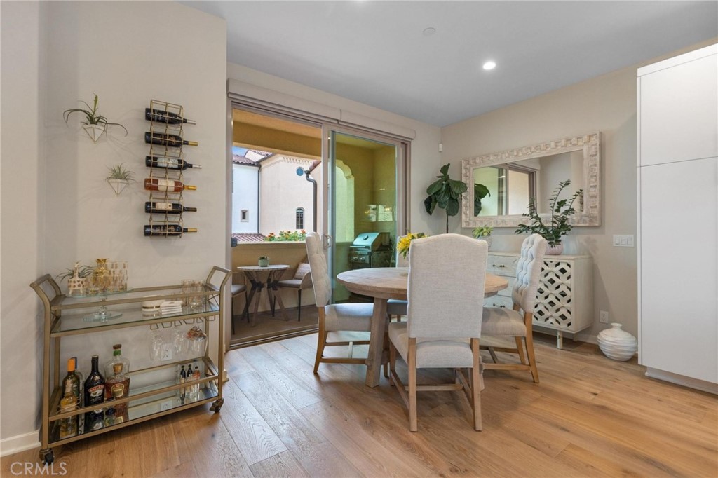 125 Leafy Twig Irvine, CA 92618 - Photo 8 of 35 a view of a dining room with furniture and wooden floor