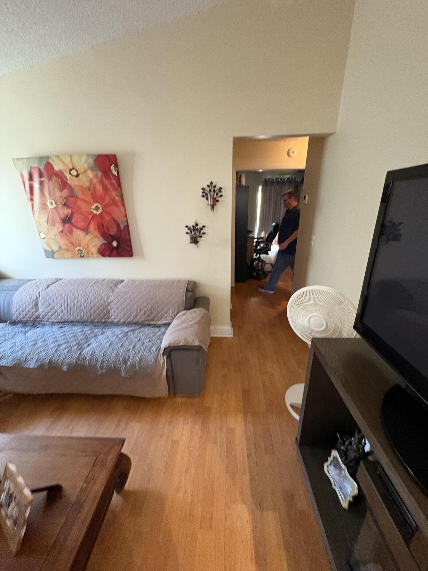 1011 Southwest 134th Avenue Davie, FL 33325 - Photo 11 of 18 a living room with furniture and a wooden floor