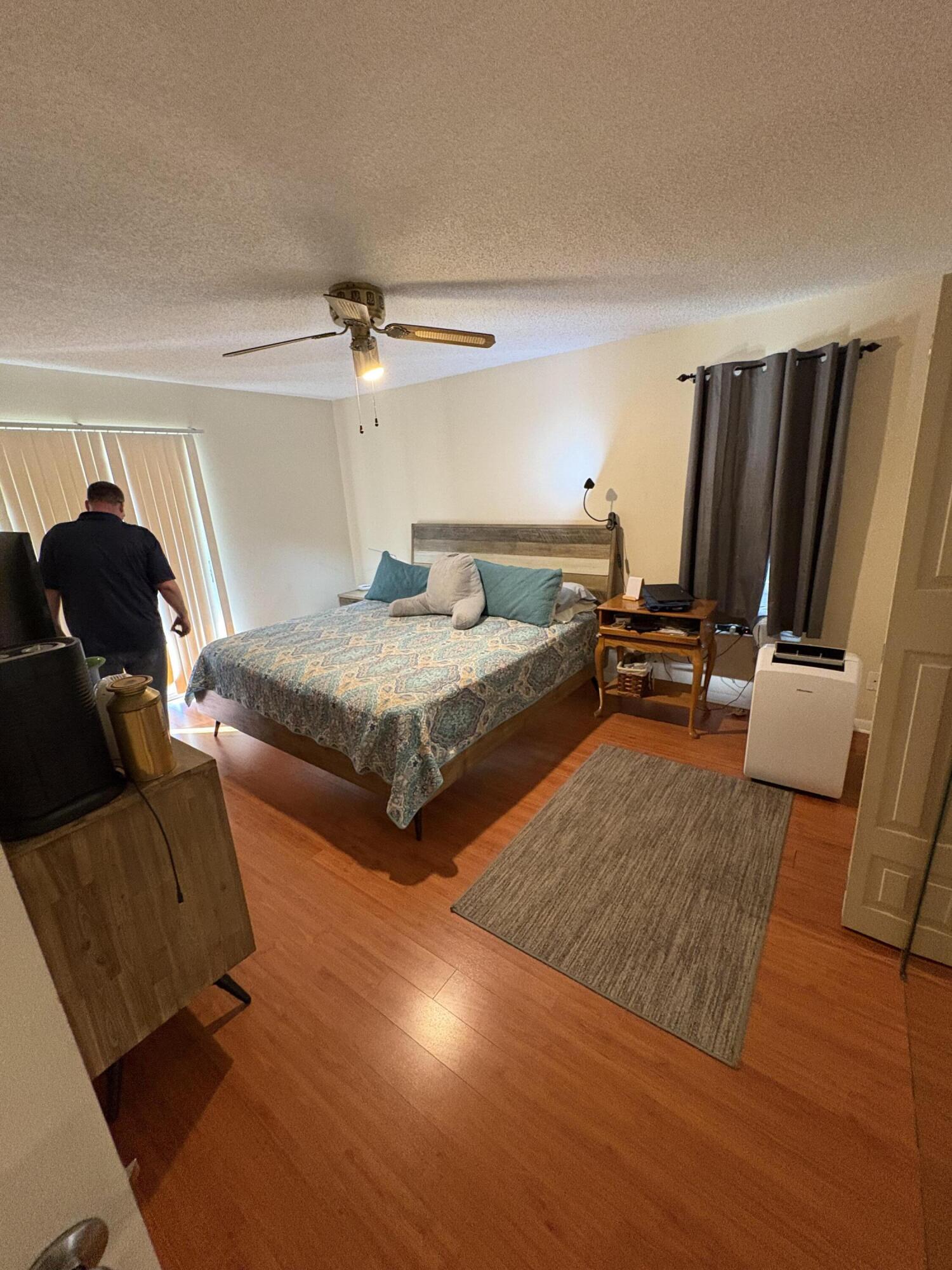 1011 Southwest 134th Avenue Davie, FL 33325 - Photo 13 of 18 a bedroom with two beds and a couch