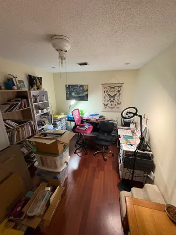 a bedroom with furniture and a mirror