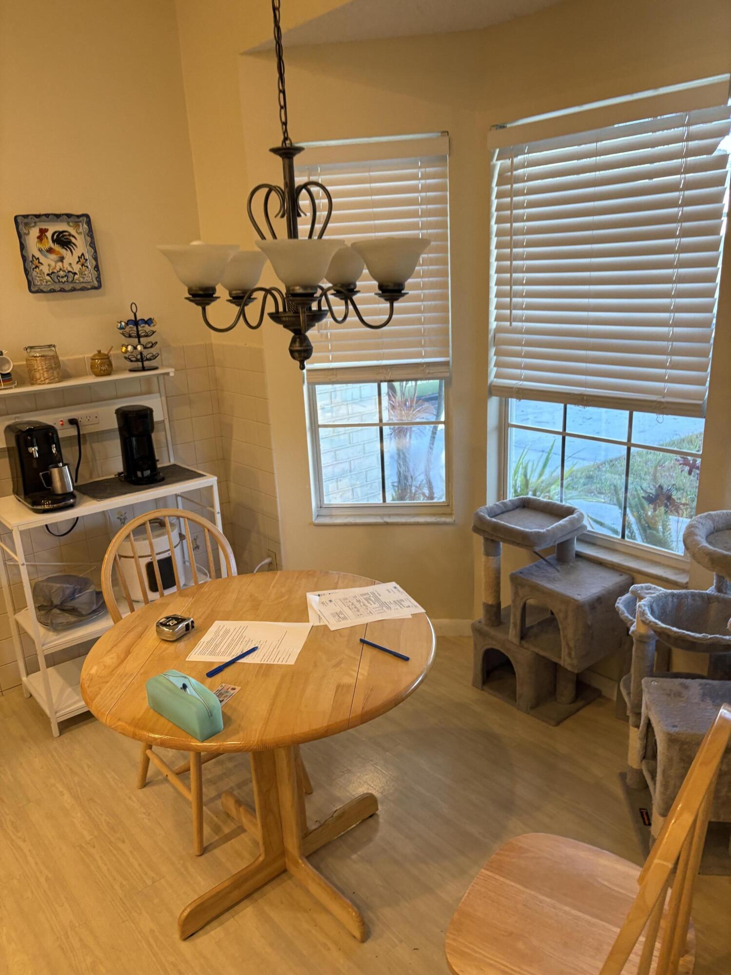 1011 Southwest 134th Avenue Davie, FL 33325 - Photo 3 of 18 a table and chairs in a room