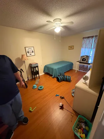 a room with furniture and screen equipment