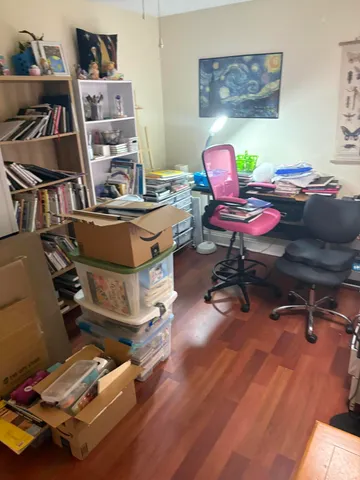 a room with furniture and wooden floor