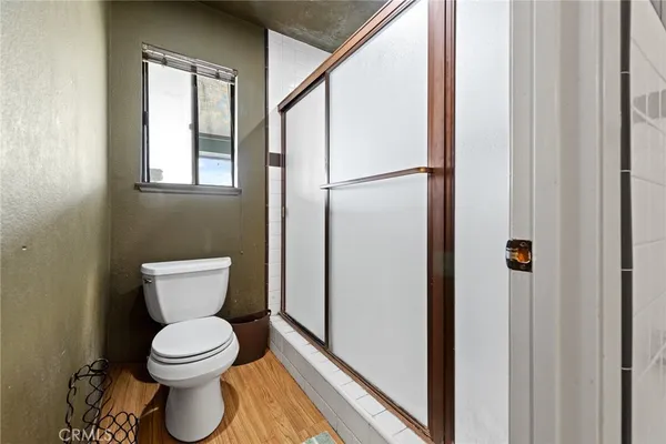a white toilet sitting next to a bathroom sink