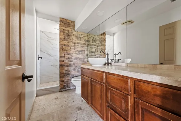 a bathroom with double vanity sink and a mirror
