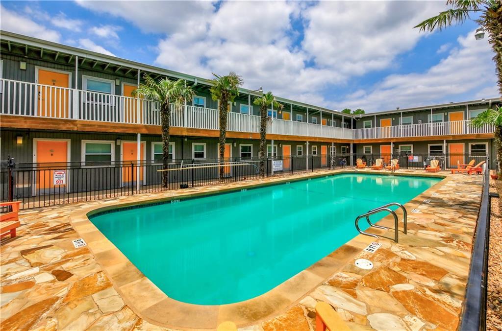 2401 Manor Road, Unit 102 Austin, TX 78722 - Photo 4 of 22 Community pool with a patio area