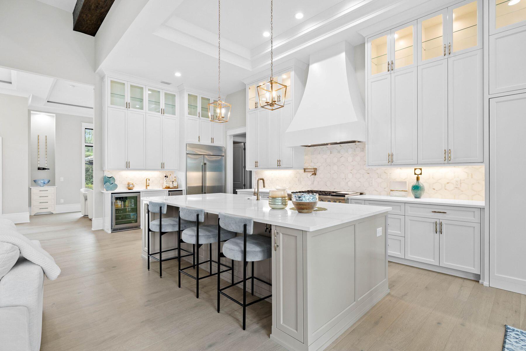 2939 Pine Valley Road Miramar Beach, FL 32550 - Photo 33 of 71 a kitchen with appliances a sink a counter and chairs