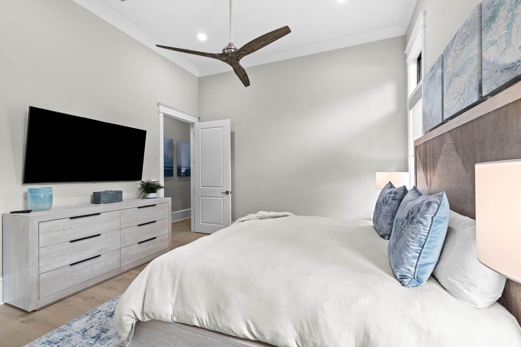 2939 Pine Valley Road Miramar Beach, FL 32550 - Photo 62 of 71 a bedroom with a bed tv and flat screen tv