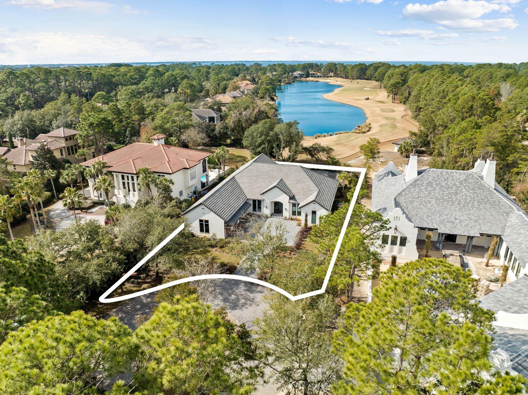 2939 Pine Valley Road Miramar Beach, FL 32550 - Photo 65 of 71 an aerial view of a house with a garden and lake view