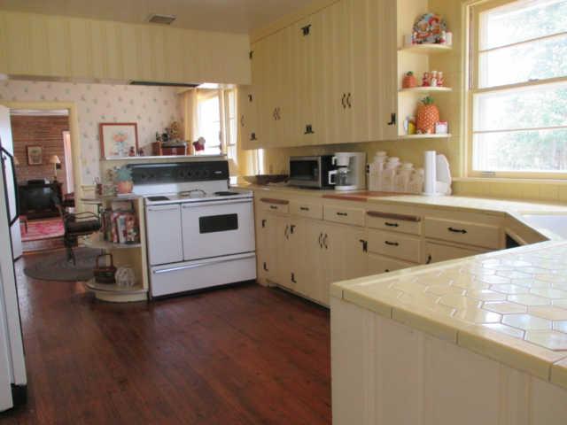 238 Hicks Cut Road Pulaski, TN 38478 - Photo 10 of 20 a kitchen with a stove a sink and a refrigerator